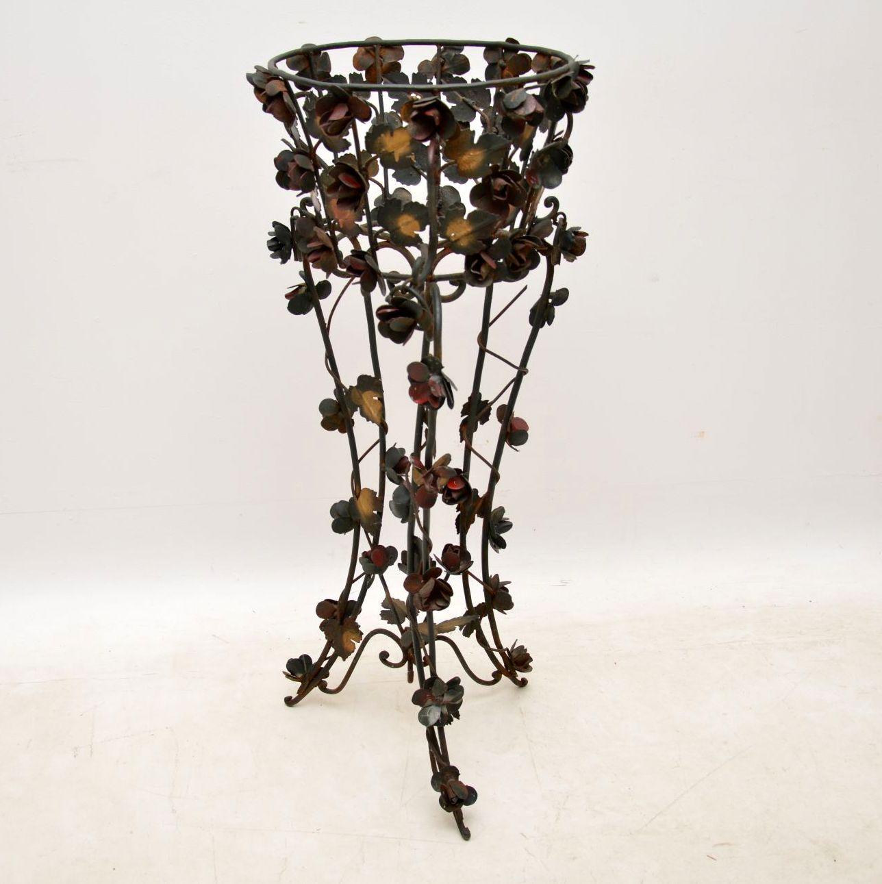 This antique painted wrought iron plant stand has fabulous floral decoration all over and is still in good original condition. The painting too is all original and hasn’t been touched up. It was very dirty when we picked it up and when we cleaned it