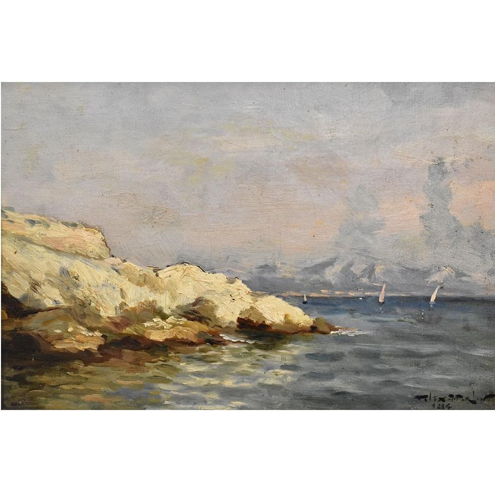 This is a Small Marine Oil Painting, which represents a Marina with A Rocky Cliff and Sailing Boats. 
The work represents a glimpse of a rocky coastline with three small boats .

It is an oil painting on canvas from the 1800s. The painting and