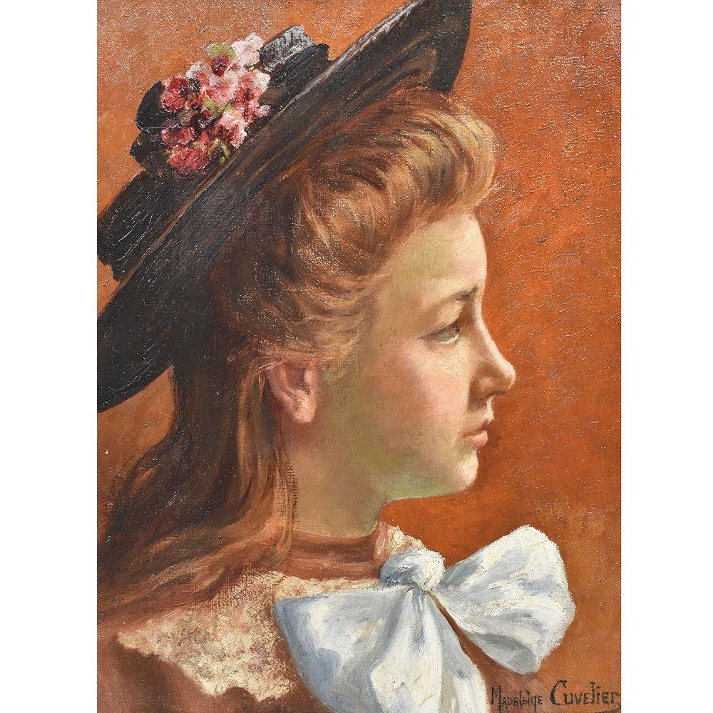 This is a portrait Artwork of a young woman with hat. This girl oil painting has an original golden frame realised in the 1900s.
The old painting has the signature of the painter, Madeleine Cuvelier (XIX-XX), french painter and is dated 1905 on the