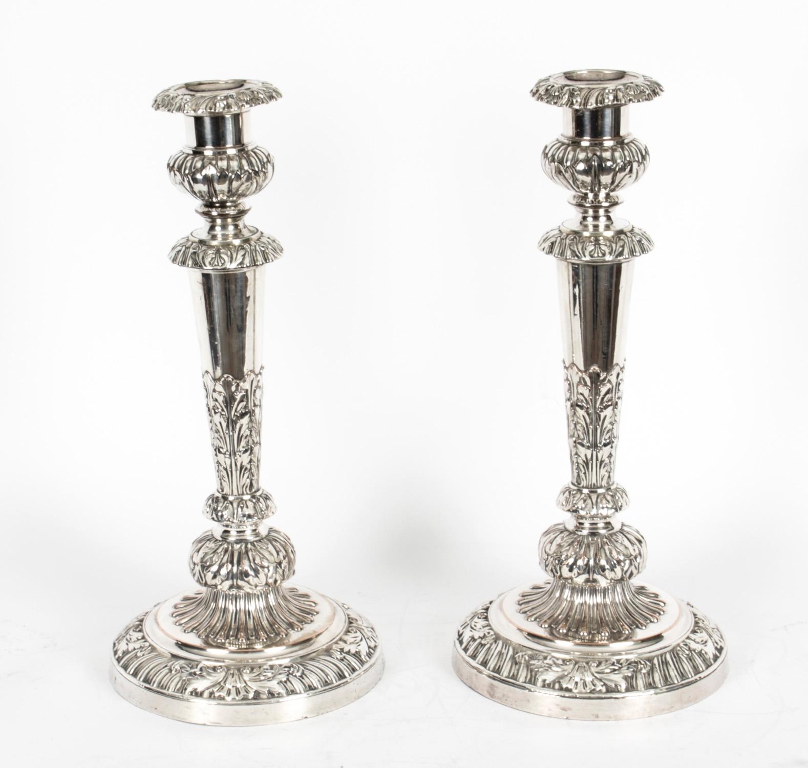This is a stunning monumental pair of antique English Old Sheffield silver on copper, three light, two-branch table candelabra, circa 1790 in date, and bearing the sunburst makers marks of the world renowned silversmith Matthew Boulton.
 
The