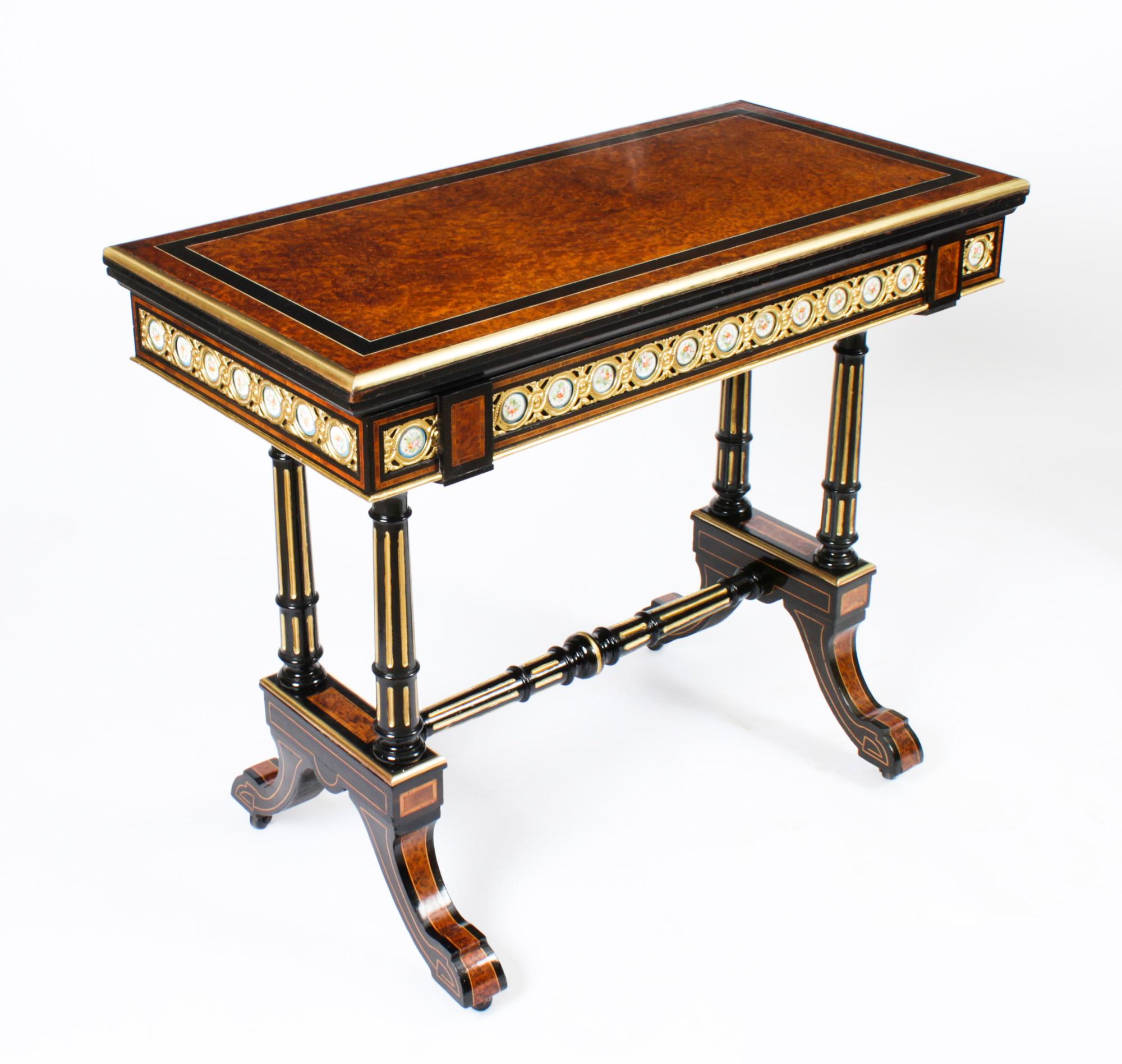 This is a stunning pair of antique French amboyna and ebonised card tables, circa 1860 in date.
 
The tables are made from striking and rare amboyna, and then each is beautifully decorated with forty fabulous Sevres porcelain plaques which feature