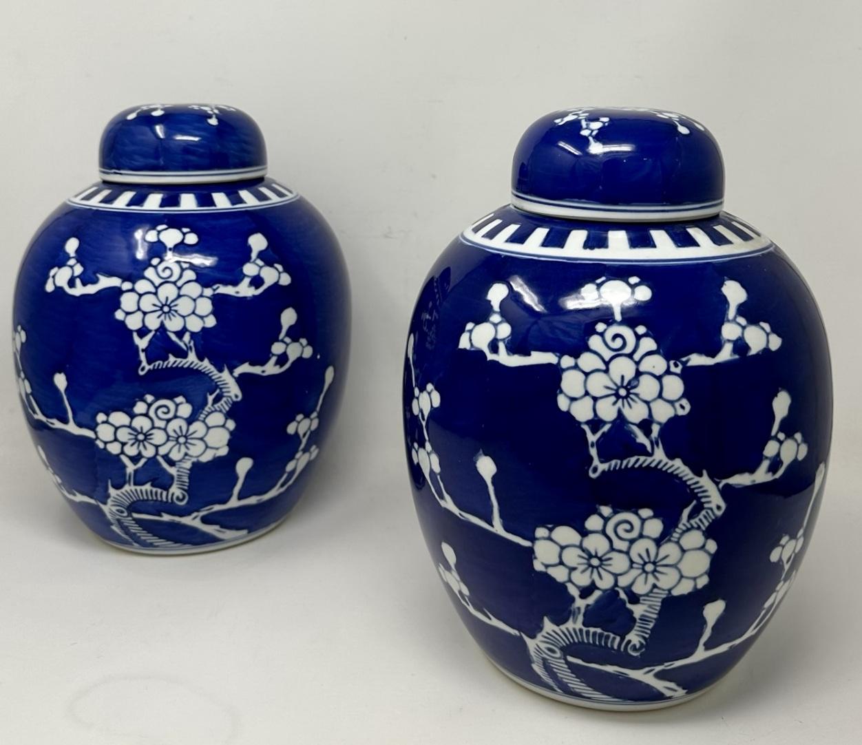 Stylish identical Pair of Early Chinese Export quite large Ginger Jars, early to mod Twentieth Century, complete with their original covers. 

Each Jar hand painted in underglaze blue on an off-white ground, decoration depicts branches of Prunus