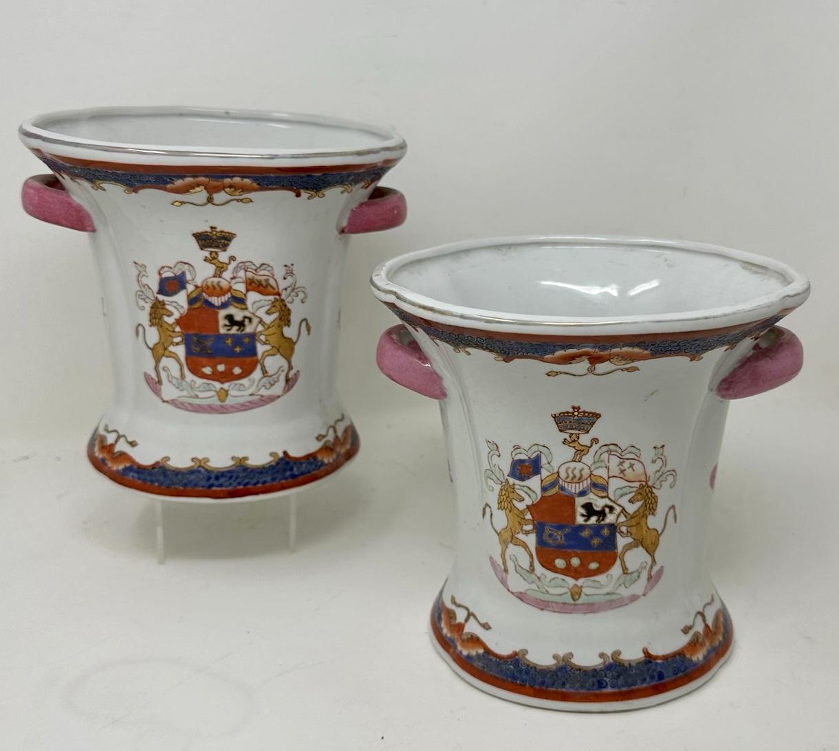 Stunning Pair Traditional Armorial Chinese Export oval form exquisitely hand painted Porcelain Vases of quite large proportions. Third quarter of the Nineteenth Century.   

The main outer heavy gauge porcelain body of waisted form and flared rims