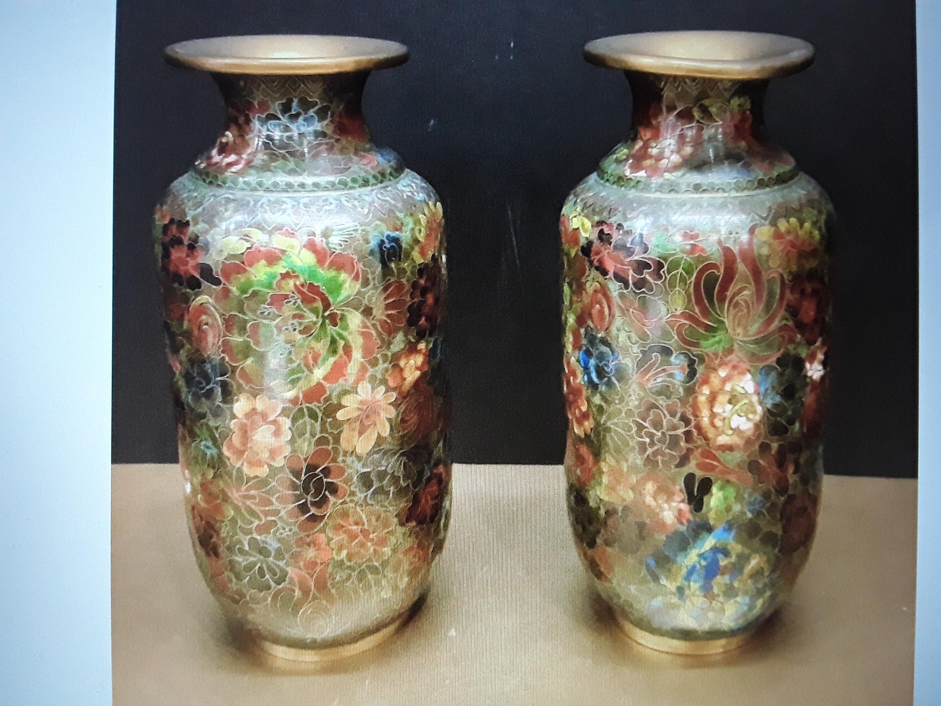 A Stunning Pair of Antique Asian Cloissone Vase. Green earthy tones. Beautiful pair with one very small not noticeable dent. Not detracting in the least.
