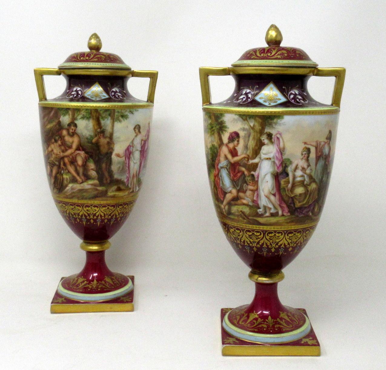 Stunning Pair of Royal Vienna Austrian Hand Painted Two Handled Mantle Vases of Museum quality of ovoid outline, ending on circular bases, complete with original finial covers. 

Painted by renowned porcelain artist A. Heer. Last half of the