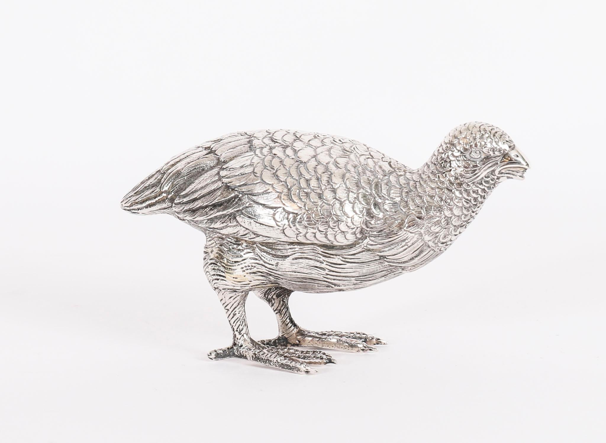 This is a stunning Antique Belgian pair of silver grouse with exceptional detailing to the modelling of the birds, bearing the makers mark ZL and the silver mark A835 405g (13.02 oz.t.), for .835 silver, marked to the underside of the foot, circa