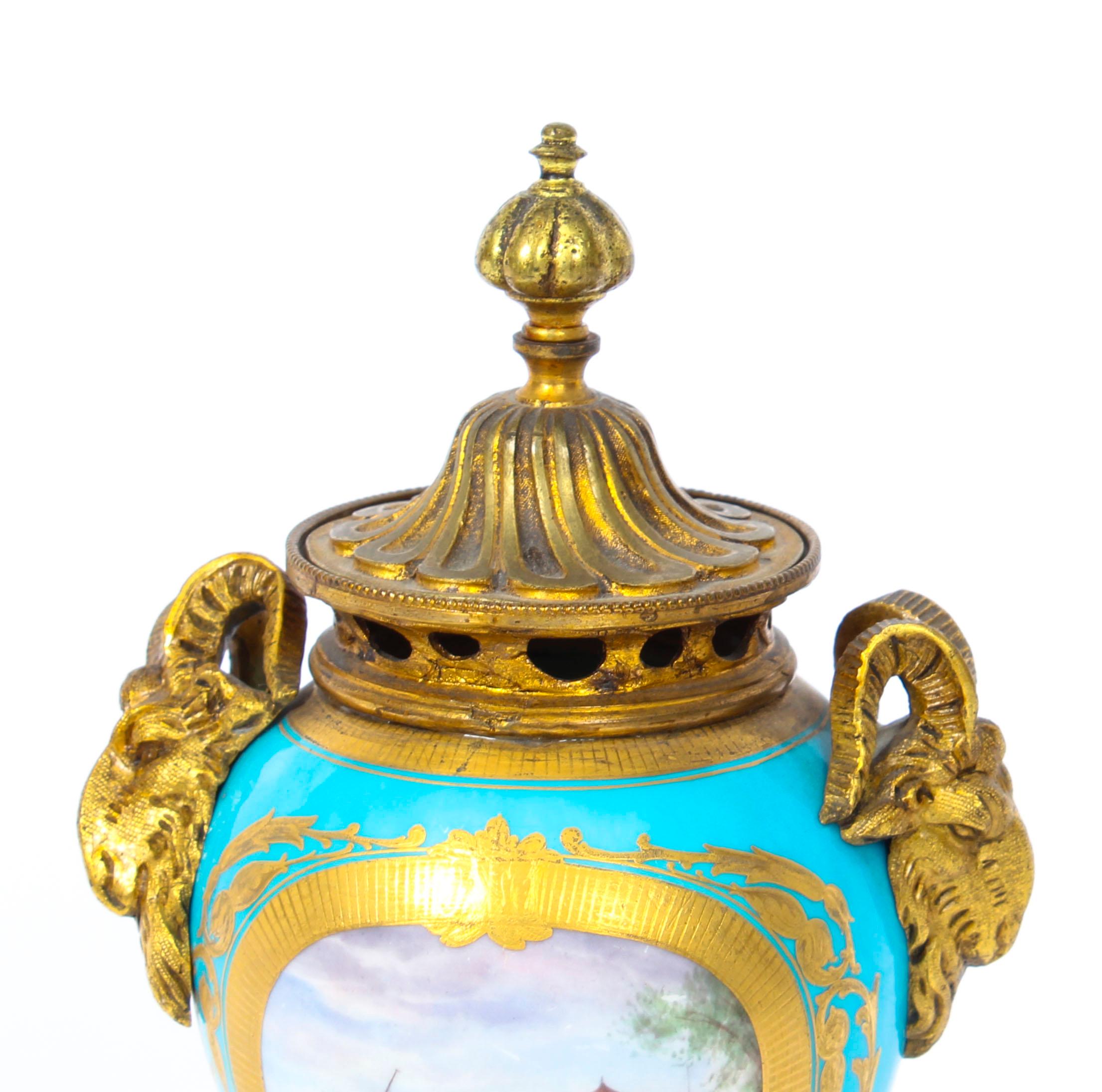 Pair of Bleu Celeste Sevres Porcelain Gilt Bronze Lidded Urns, 19th