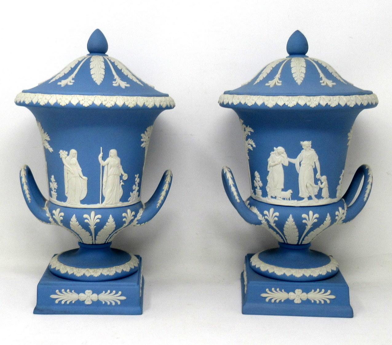 An Exceptionally Fine Example of a Pair of English Jasperware Wedgwood Urns of good size proportions. Mid Twentieth Century. 

The twin arched handle Campana form urn decorated in relief depicting neoclassical scenes of adult figures and children
