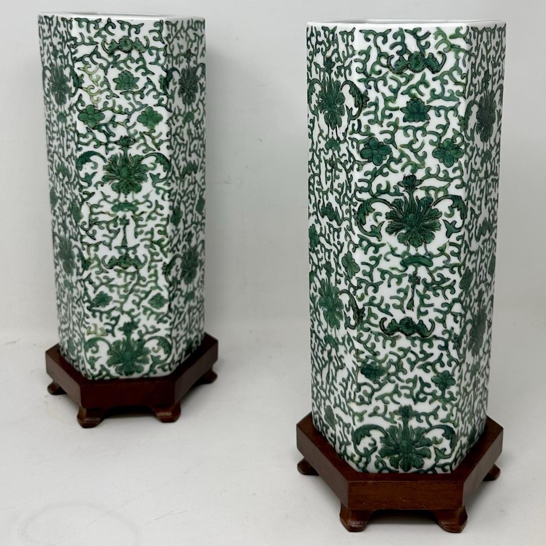 Stunning Pair Traditional Chinese Export octagonal form exquisitely hand painted Porcelain Vases of quite large proportions. Third quarter of the Nineteenth Century. 

The main outer porcelain body of cylindrical outline hand decorated allover