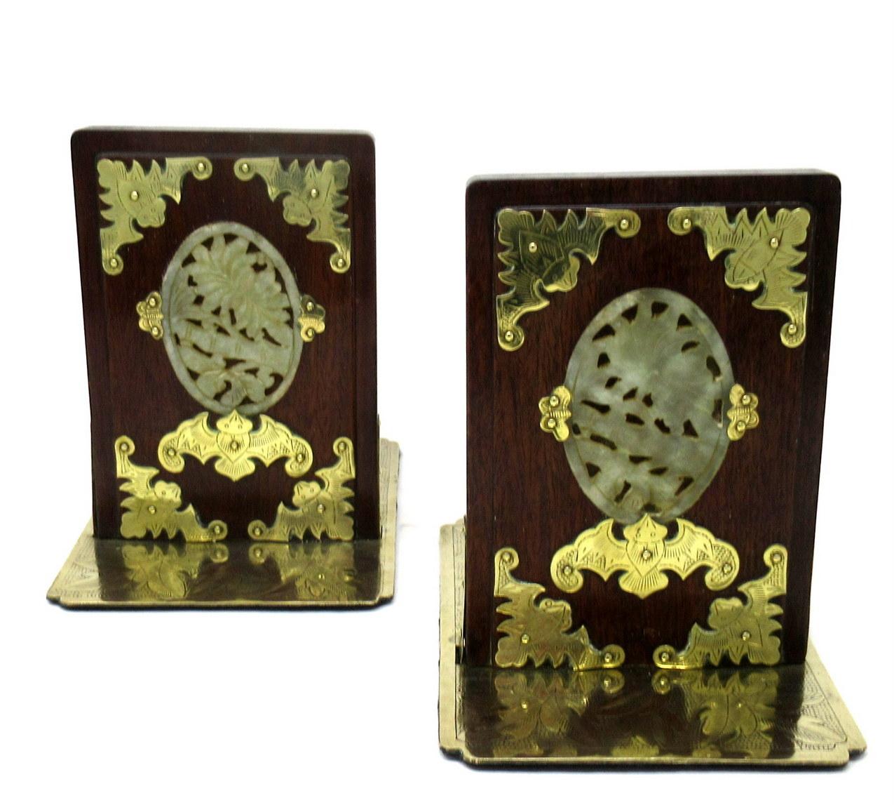 An Extremely Stylish Pair of Chinese Flame grained Hardwood and carved Jade Bookends of outstanding quality. Mid Nineteenth Century. 

Each central featured oval hand carved jade medallion depicting birds and flowers is secured by a trio of
