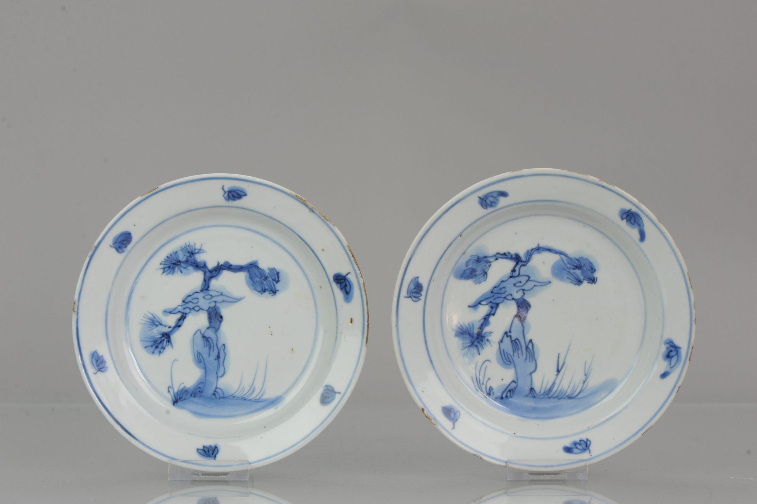 A blue & white Kosometsuke plate with a lovely scene of a gnarled pine tree.
A gnarled pine tree, which may represent either survival in a harsh political environment or the unconquerable spirit of old age.

Condition
Both with typical