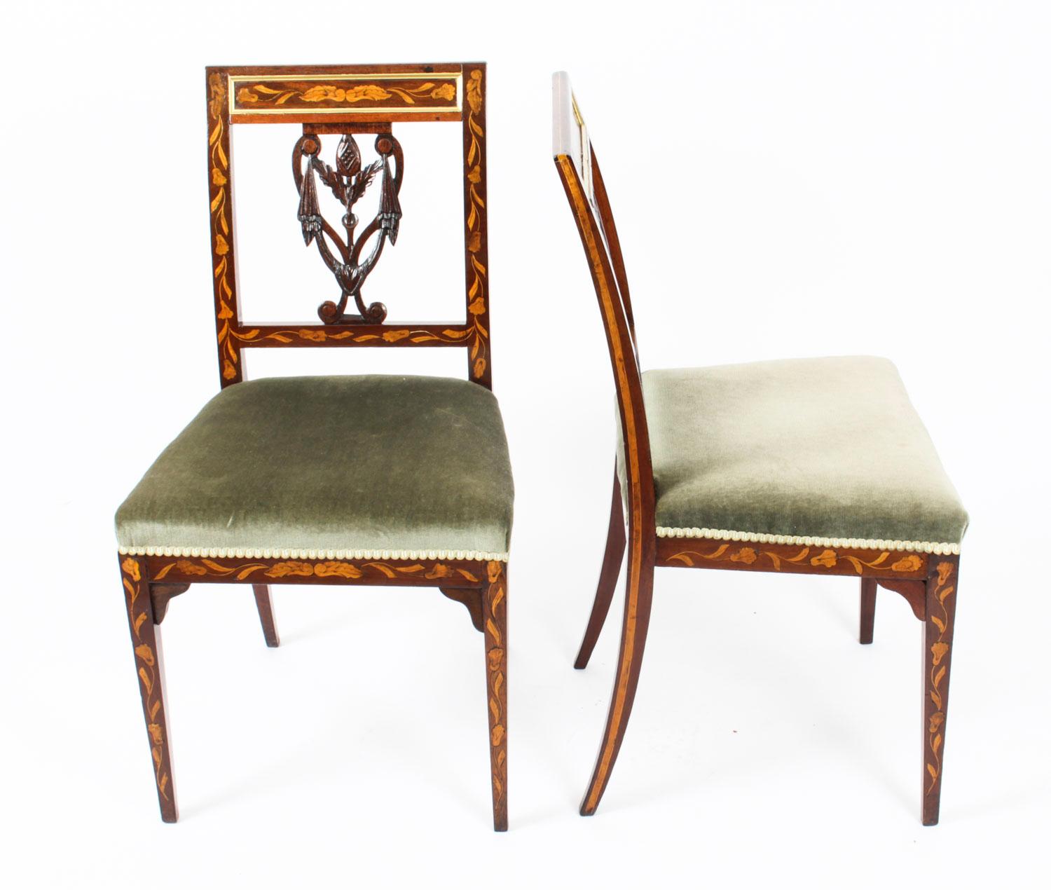 A beautiful and rare pair of antique Dutch Regency marquetry side chairs upholstered in pale green fabric and Circa 1820 in date.

They are made from mahogany and beautifully inlaid with floral marquetry, typical of Dutch furniture of this period.