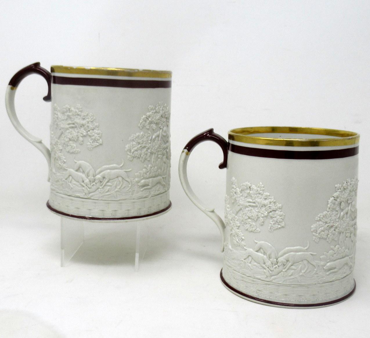 Rare identical Pair of early George III Davenport English feldspathic glazed stoneware pair of Tankards of generous proportions. Circa 1800-1810. 

Each light gilt rimmed cream coloured body is decorated with engine turning at base, the main central