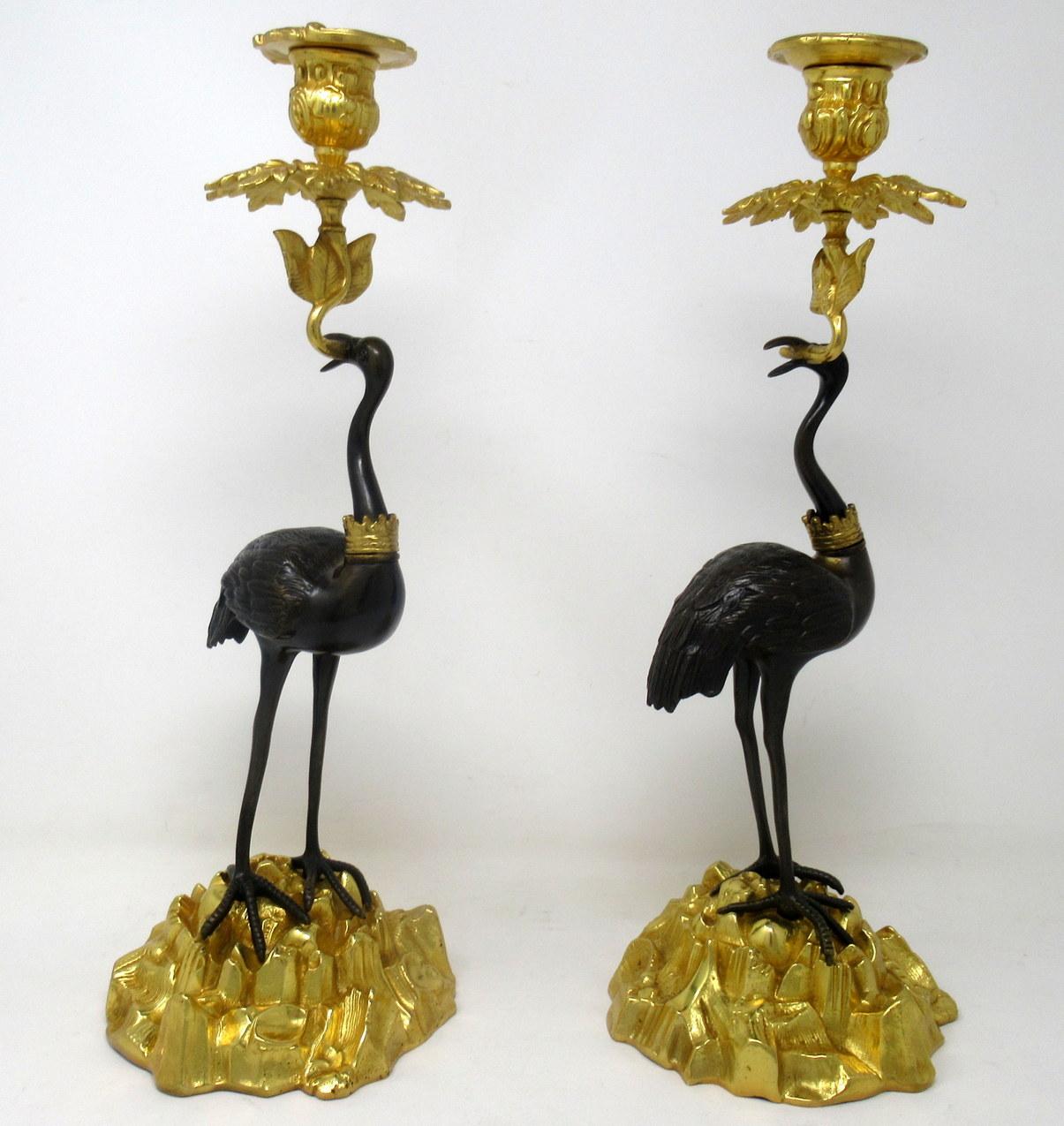 Stunning pair of English ormolu and patinated bronze single light candlesticks of good size proportions modelled as a pair of storks, firmly attributed to Thomas signed Abbott, circa 1840-1860.

Each exquisitely modelled as standing storks or