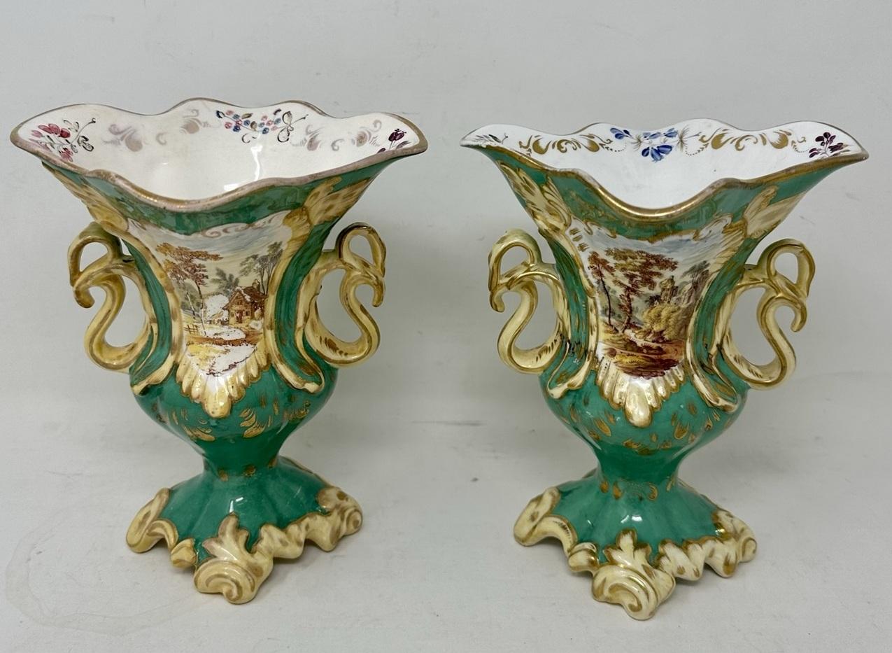 An exceptionally fine quality identical pair of English rococo revival twin handle mantle vases, firmly attributed to Samuel Alcock, circa second quarter of the 19th century. 

Each Vase of baluster outline with unusual shaped and flaired rims and