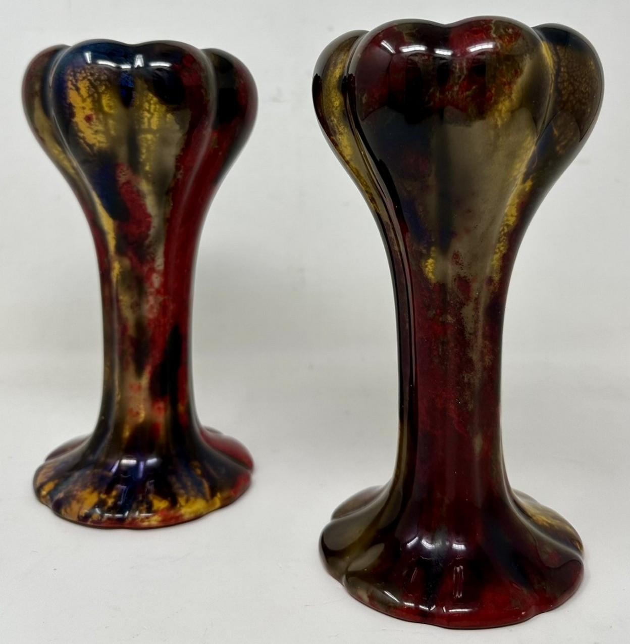 An Exceptional Pair of English Royal Doulton Flambe Sung Ware Earthenware Vases firmly attributed to Charles Noke. First quarter of the Twentieth Century, possibly early Art Deco Period. 
Each high – fired glazed vase of ovoid outline with ribbed