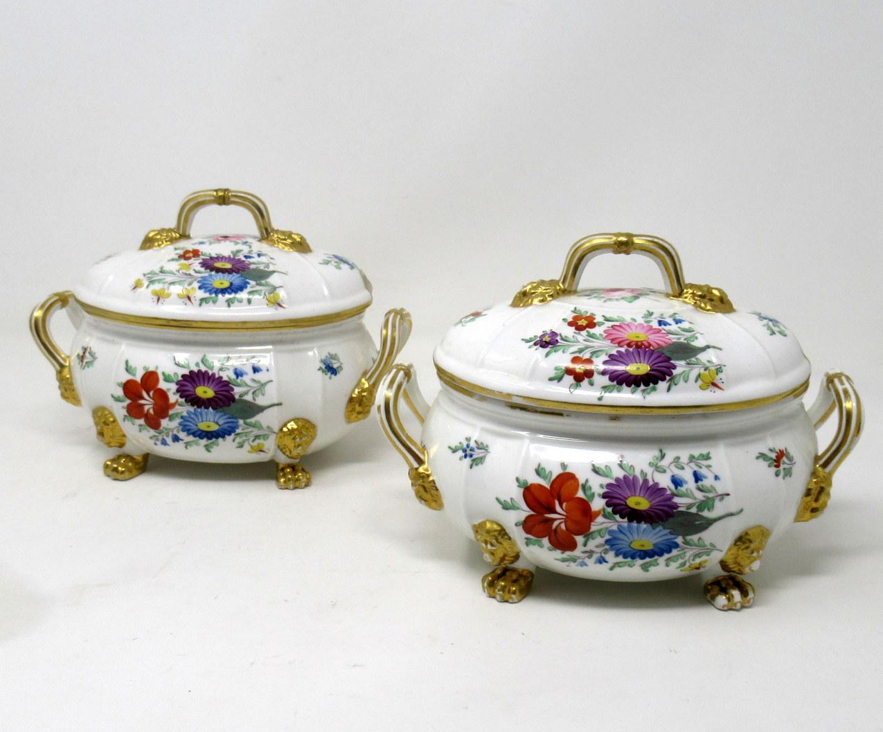 Very elegant pair of early English Regency Royal Crown Derby Twin Scroll Handle Oval Outlined Food Tureens of compact proportions. First quarter of the 19th century. 

Lavishly gilded and hand decorated with various Summer Flowers on an off-white