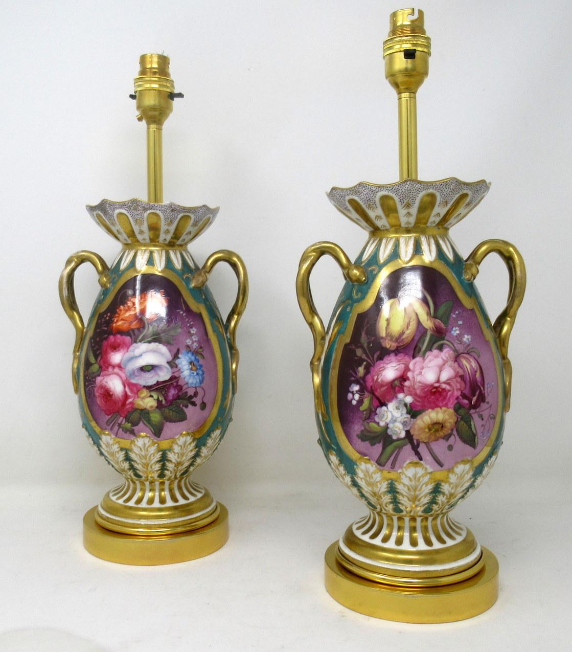 An exceptionally fine pair of English Staffordshire Porcelain mantle vases now converted to electric table lamps of medium proportions, Circa 1860.

Of traditional bulbous outline with a central reserve hand painted with old fashioned Summer