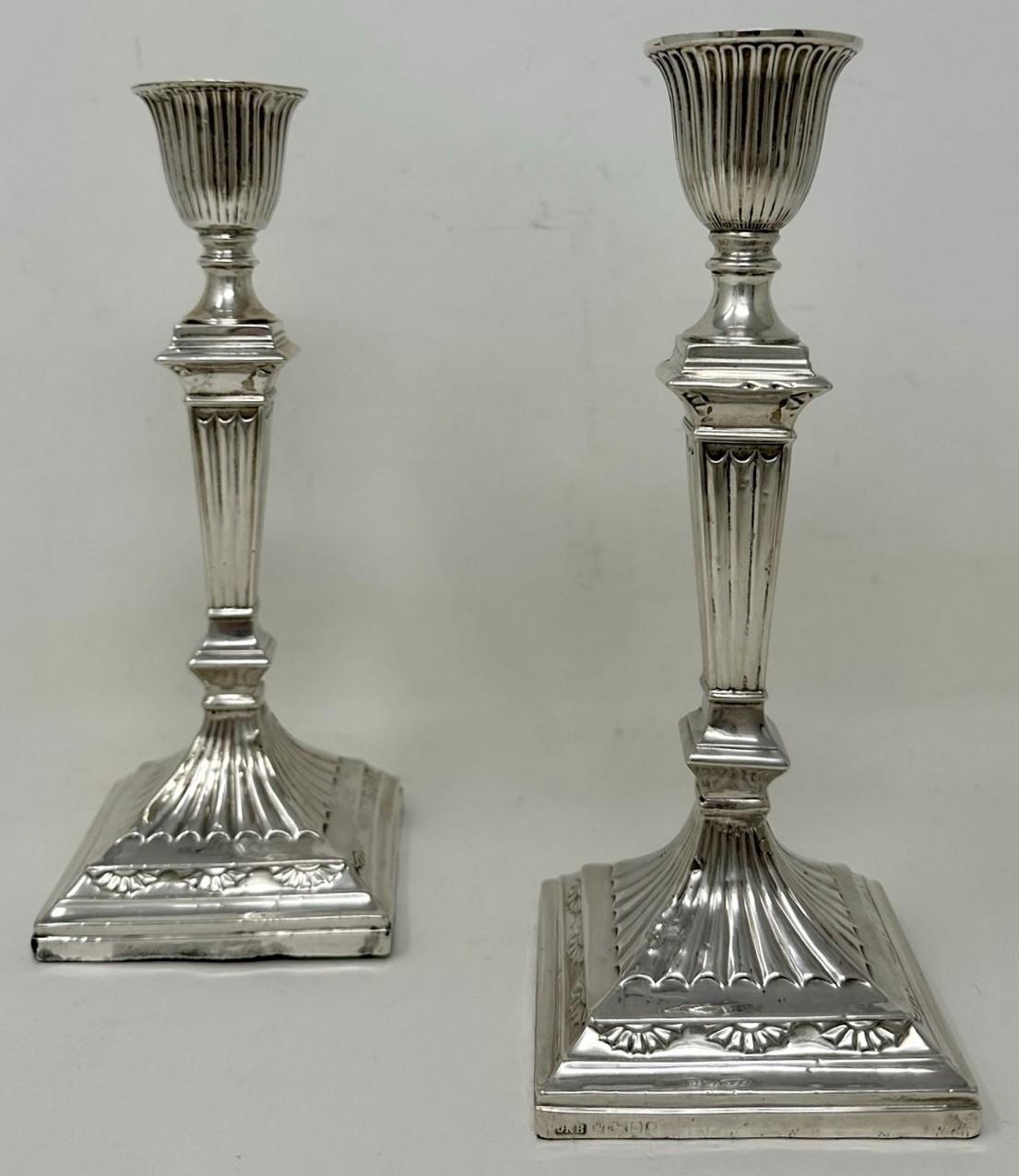 Impressive Pair of English Neo-Classical Adams Style Sterling Silver Single Light Table or Desk Candlesticks of medium proportions. 

Each with decorative swag relief decoration to the weighted bases, fluted and tapering central stems below reeded