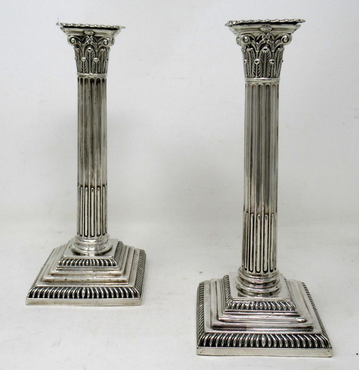 Stylish identical pair English sterling silver single light table or desk candlesticks of outstanding quality and quite good condition. Last quarter of the nineteenth century. 

Mark of HAWSWORTH ERYNE & Co. 

Sheffield Hallmark for 1886