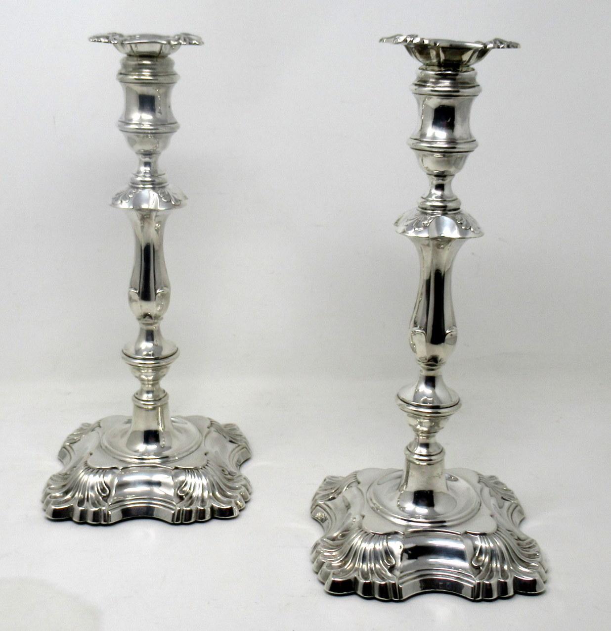 Stylish Pair of early Edwardian English heavy gauge Sterling silver single light table candlesticks of outstanding quality and seldom offered large proportions. 

Mark of William Hutton & Sons. Farringdon, London. London Hallmark for 1905.