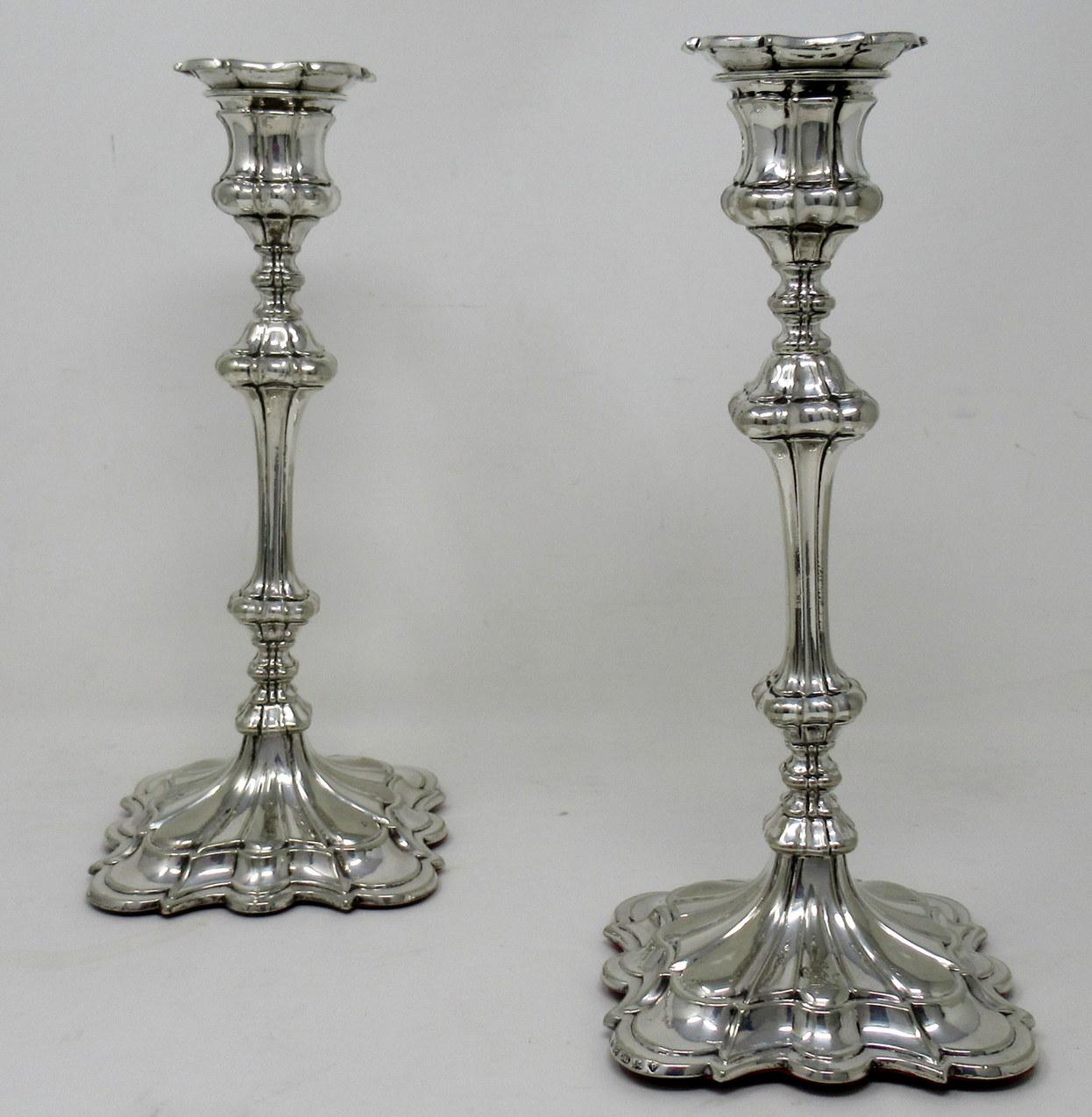 Beautiful and stylish high-quality pair of antique Elkington and Co silver heavy gauge plated candlesticks made in the George III style with square ribbed tapering columns, annulated knops and raised stepped square petaled and weighted bases.
