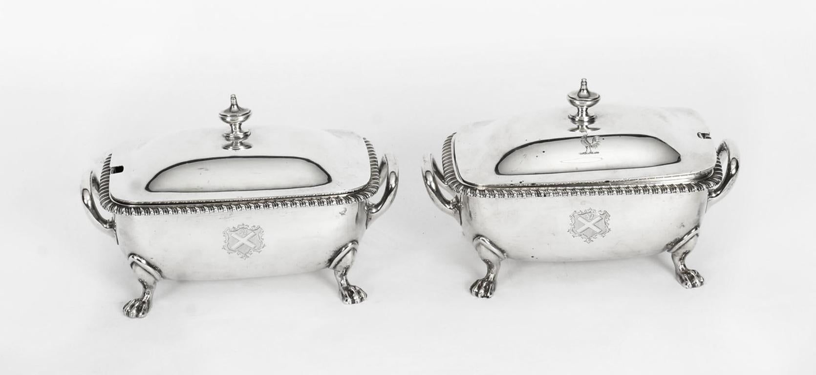 A stunning pair of late Victorian sterling silver sauce tureens, liners and covers by the Crown Jeweller, Garrard and Co., with hallmarks for London 1895 & 1901.

Of rounded rectangular shape with oval urn finials to the domed covers, and