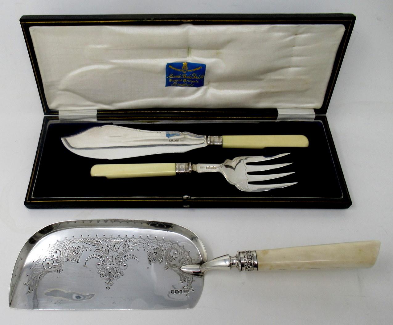 Superb Pair of English Sterling Silver Heavy Gauge Fish Servers of outstanding quality, with exquisite Hand Carved Chinese Handles. Complete with its original silk lined leather case. 

The Fish Slice blade of incurved form exquisitely chased