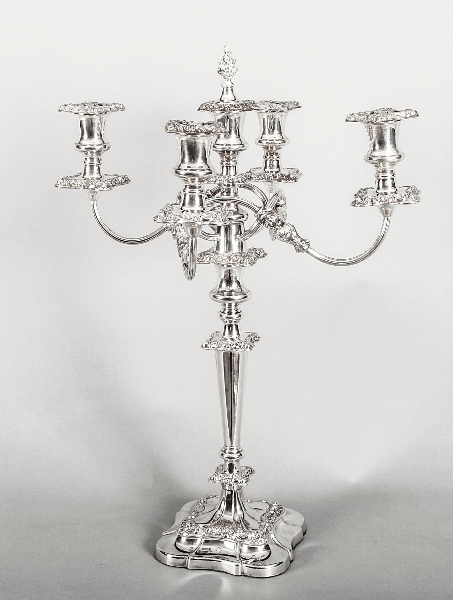 This is a magnificent high-quality pair of antique English Edwardian silver plate on copper five-light candelabra, each bearing the maker's mark of the renowned silversmith, Mappin & Webb, silversmith to Her Majesty the Queen and to His Royal