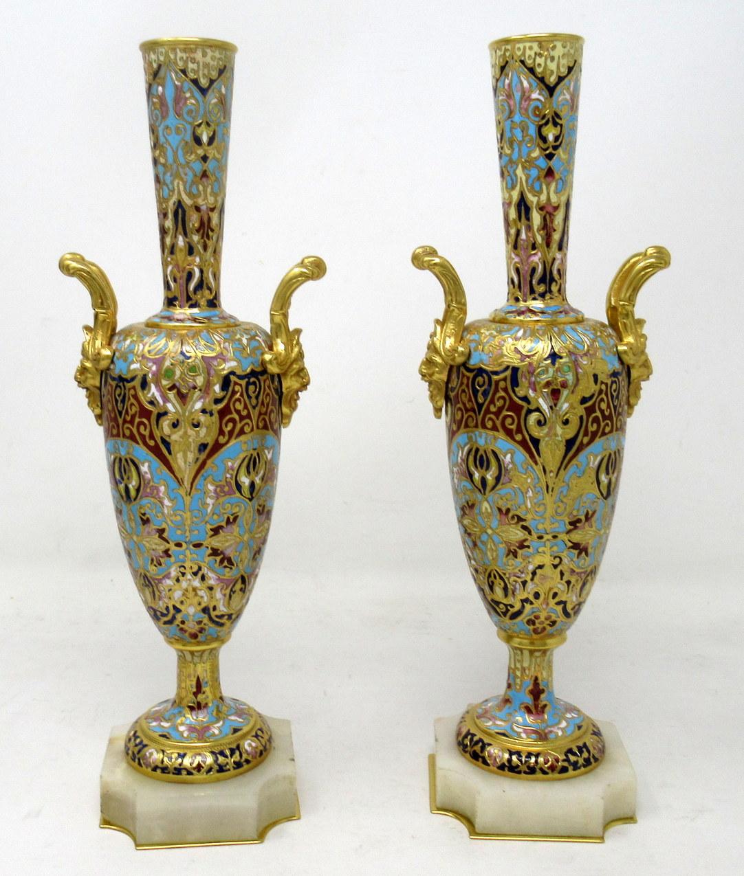 An exceptionally stylish pair of French cream Alabaster and Champleve vases of outstanding quality. Third quarter of the nineteenth century. 

This magnificent pair of vases are wrought from gilt bronze and Champleve enamel in the distinctive,