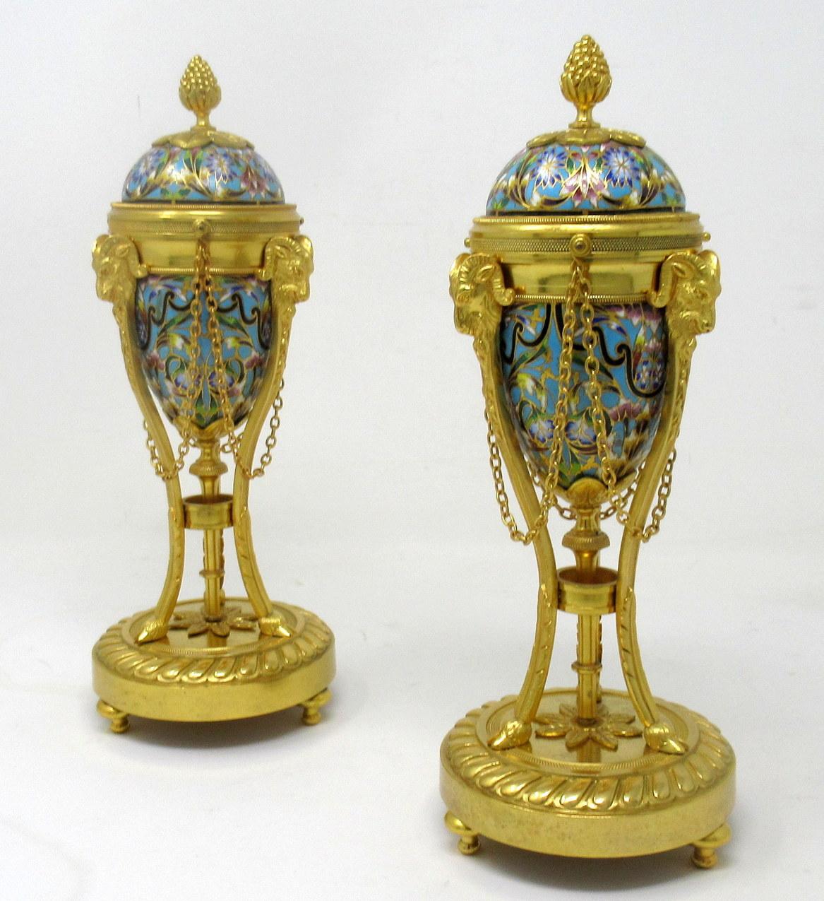 An exceptionally stylish pair of French bronze dore and Champleve Cassolettes of outstanding quality. Third quarter of the Nineteenth century. 

This magnificent pair of Vases are wrought from Gilt Bronze and Champleve enamel in the distinctive,