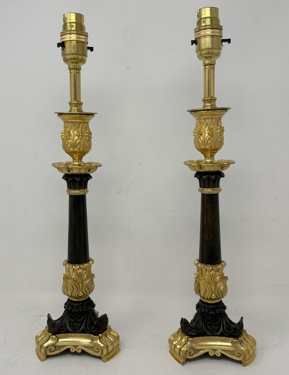An Exceptionally Fine Pair French Ormolu and patinated Bronze early Victorian Single Light Candlesticks of tall slender form and fairly standard lamp proportions, now converted to a Stunning Pair of Electric Table Lamps, offered in exceptional