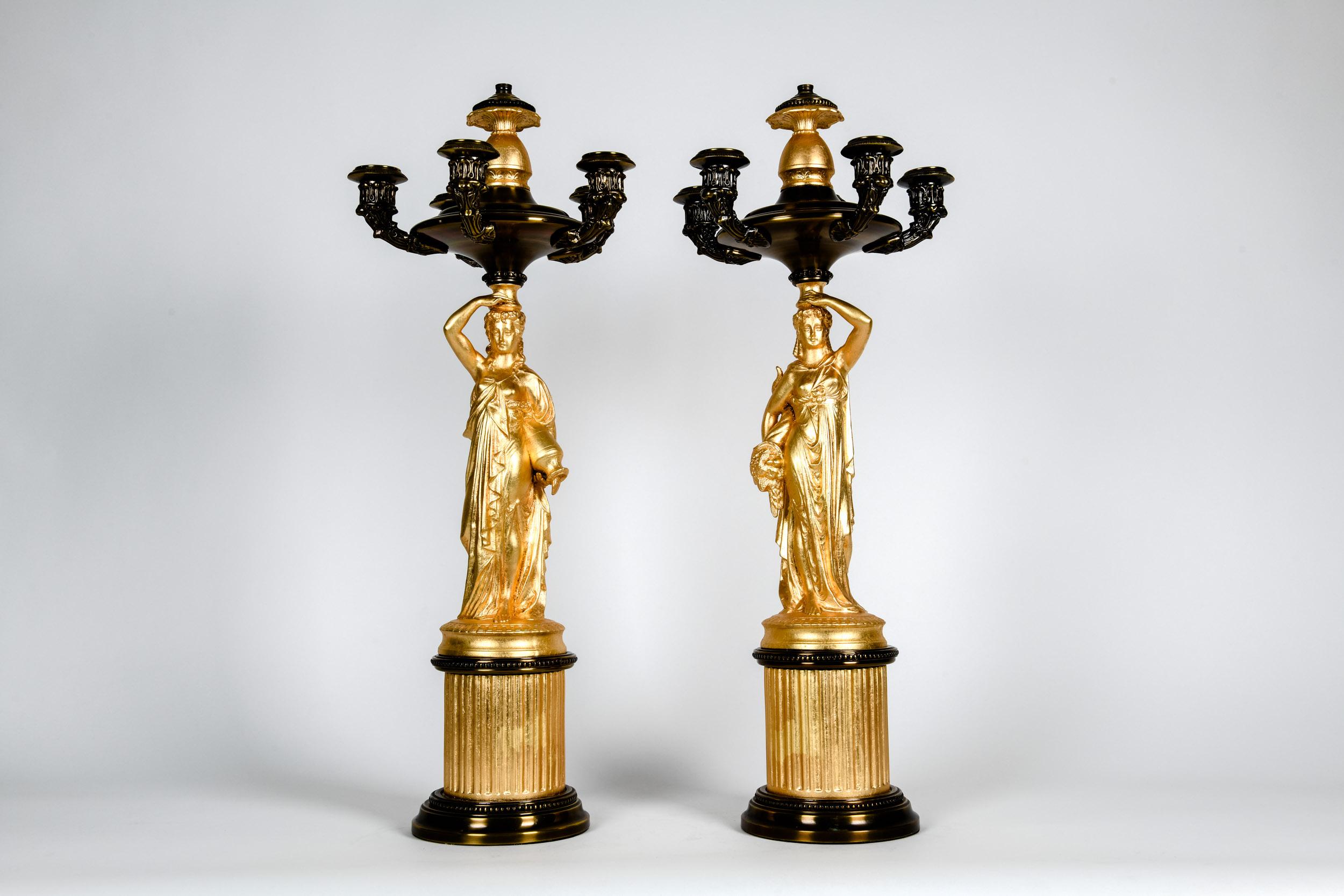 Antique pair of French porcelain / bronze five arms candelabras. Each candelabras is in excellent antique condition. Minor wear consistent with age / use. They were electrify at some point. Each candelabras measure about 25 inches tall X 11 inches