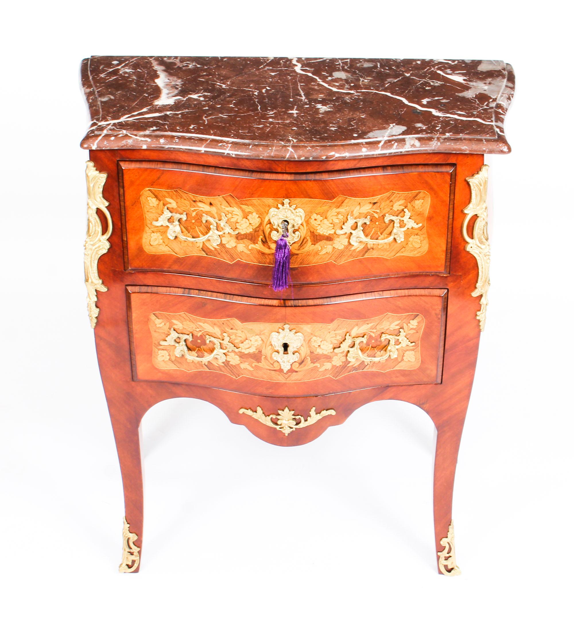 This is a gorgeous pair of antique Kingwood bombe' commodes with beautiful marquetry decoration, dating from the late 19th century.
 
These two-drawer bombe' commodes are crafted from the most beautiful Kingwood, have solid oak lined drawers and