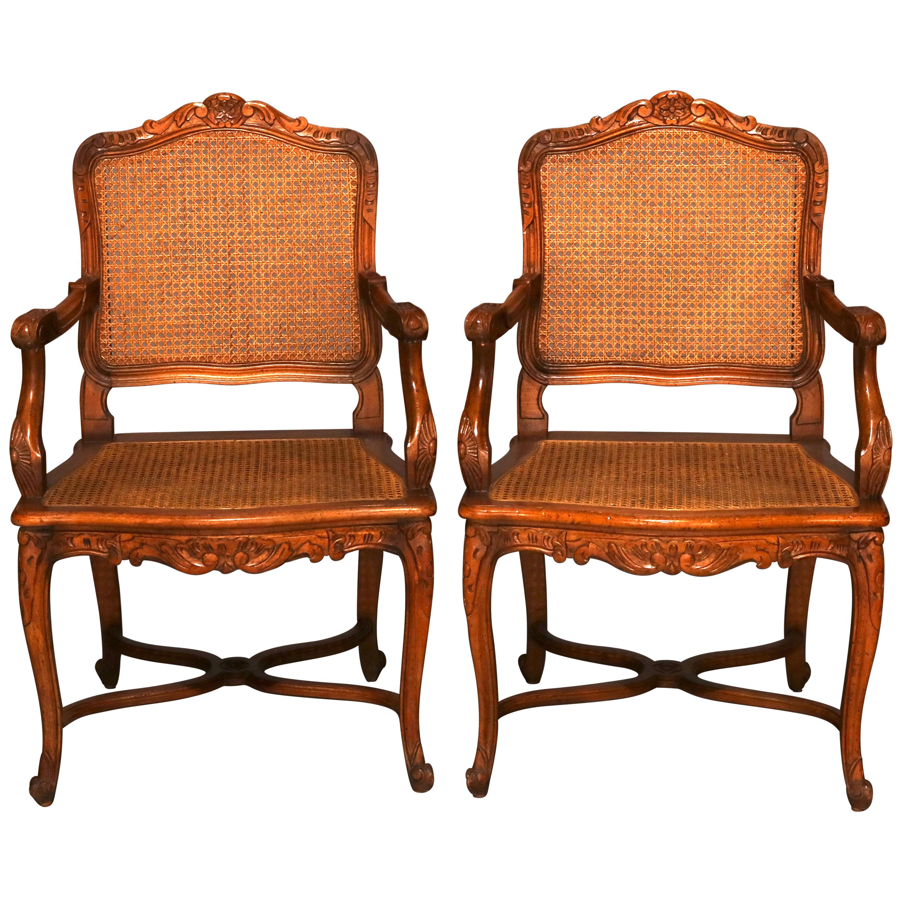 Antique Pair of French Louis XIV Pressed Walnut and Cane Chairs, circa 1920