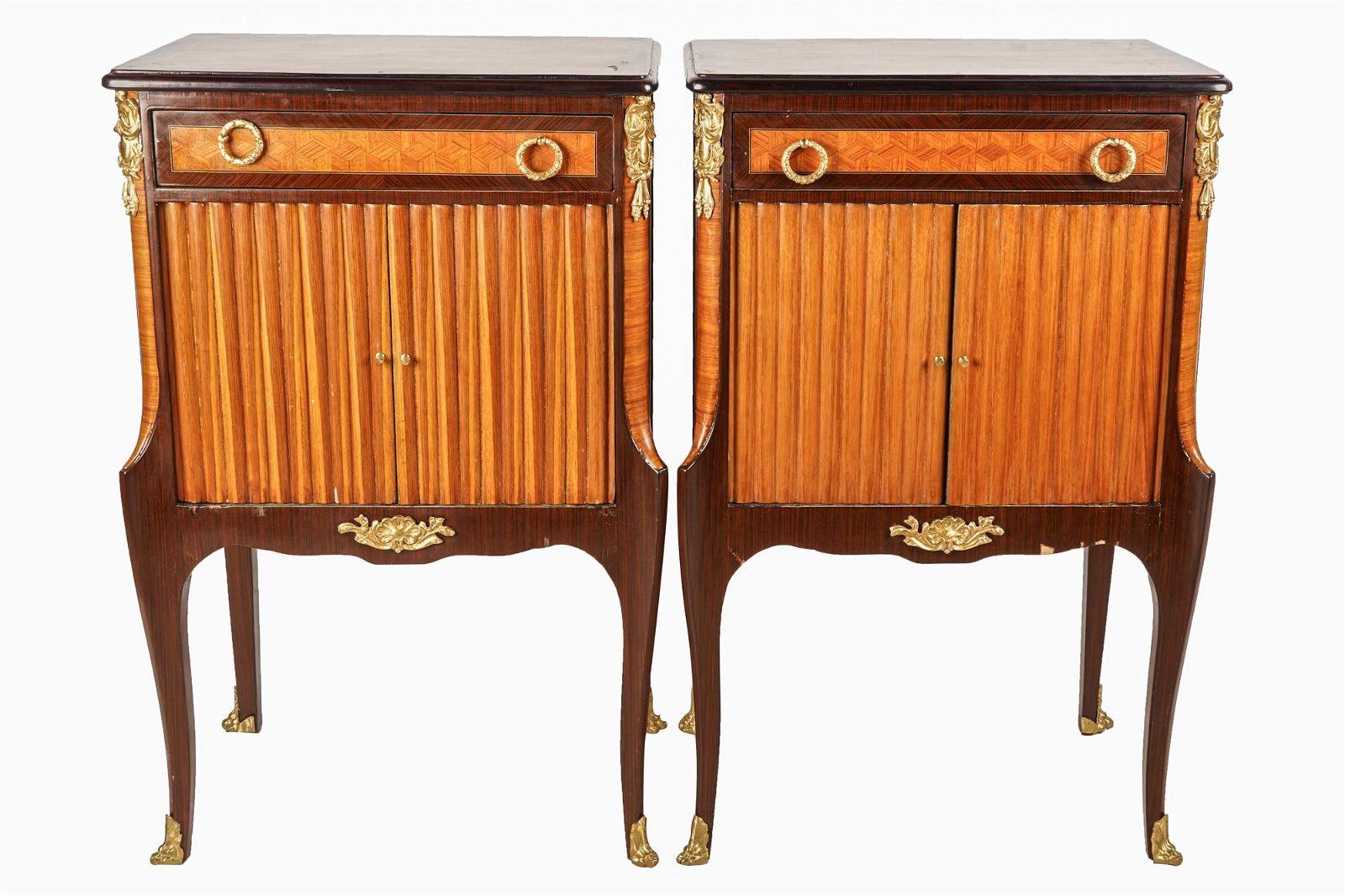 Pair of French Louis XV / XVI Transitional Style Marquetry Commodes With Exotic Satinwood, Rosewood and Walnut Woods. Rectangular satinwood marquetry top over single drawer with two gilt bronze pulls surmounting a single compartment enclosed by pair