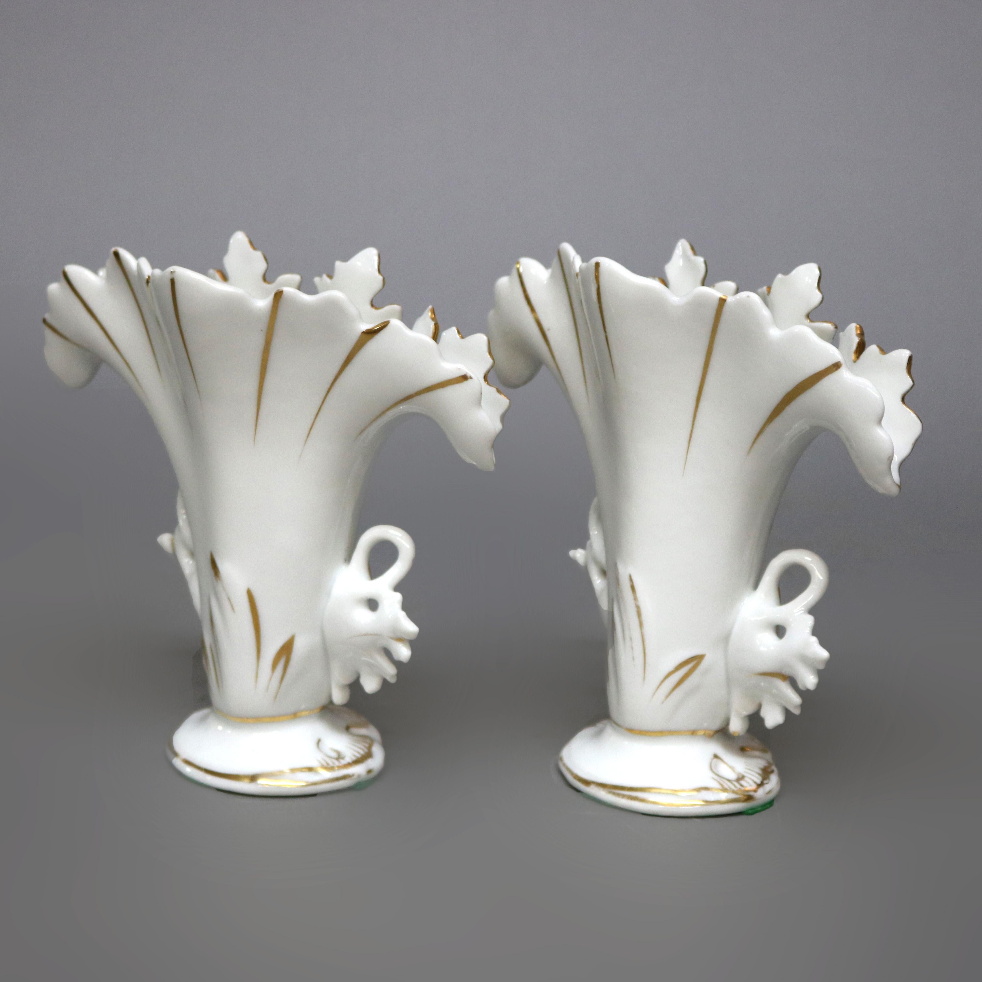 An antique pair of French Old Paris spill vases offer foliate form with gilt highlighting throughout, circa 1880.

Measures: 6.75