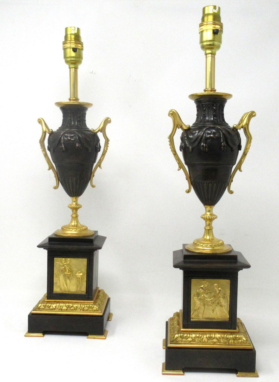 Stunning pair French heavy gauge ormolu and bronze grand tour Medici style ovoid formed urns now converted to electric table lamps, of outstanding quality of good size proportions, 

Each Urn with twin scrolling ormolu handles and a central lions