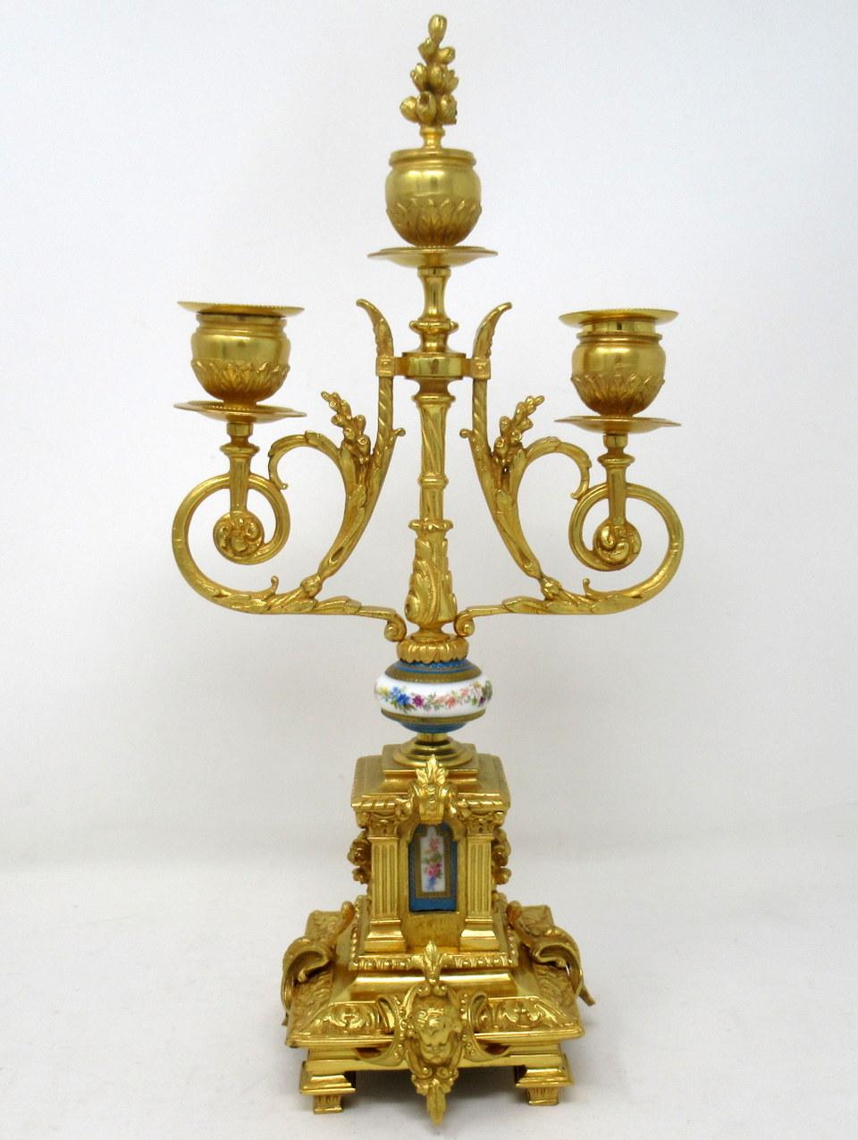 A fine stylish and imposing pair of French three-light table or mantle Sèvres Porcelain ormolu mounted candelabra of outstanding quality, mid-late 19th century.

Each with twin scrolling and one central branch above a porcelain hand decorated