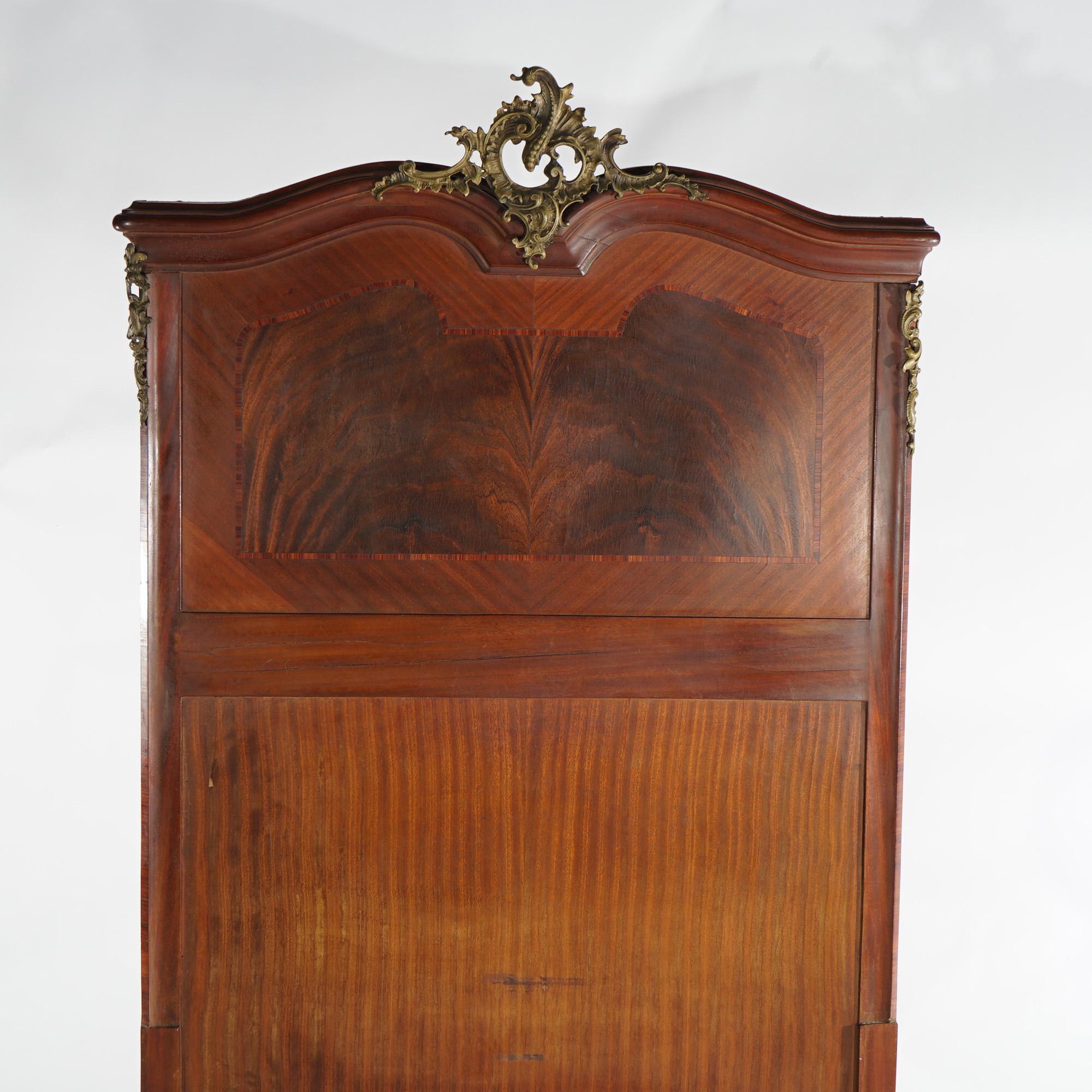 An antique pair of twin or single bed headboards offer rosewood and kingwood inlaid construction with shaped crest having foliate and gadroon cast ormolu mounts; set includes Hollywood bed frames; 20th century

Measures - 66