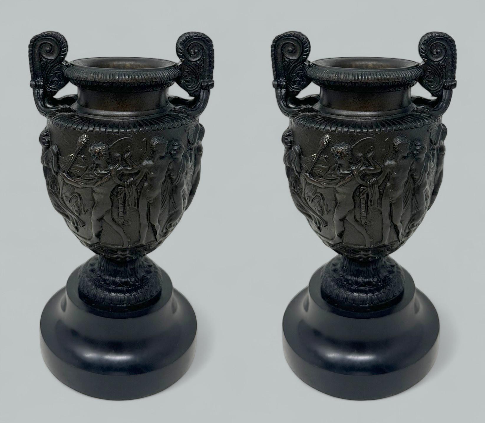 Stunning Pair of Grand Tour French Heavy Gauge Patinated Bronze Townley Urns of compact proportions and outstanding quality, after a model by Delafontaine Bronze Foundry 1750-1820. 
The main central support is a model of the Townley Vase with