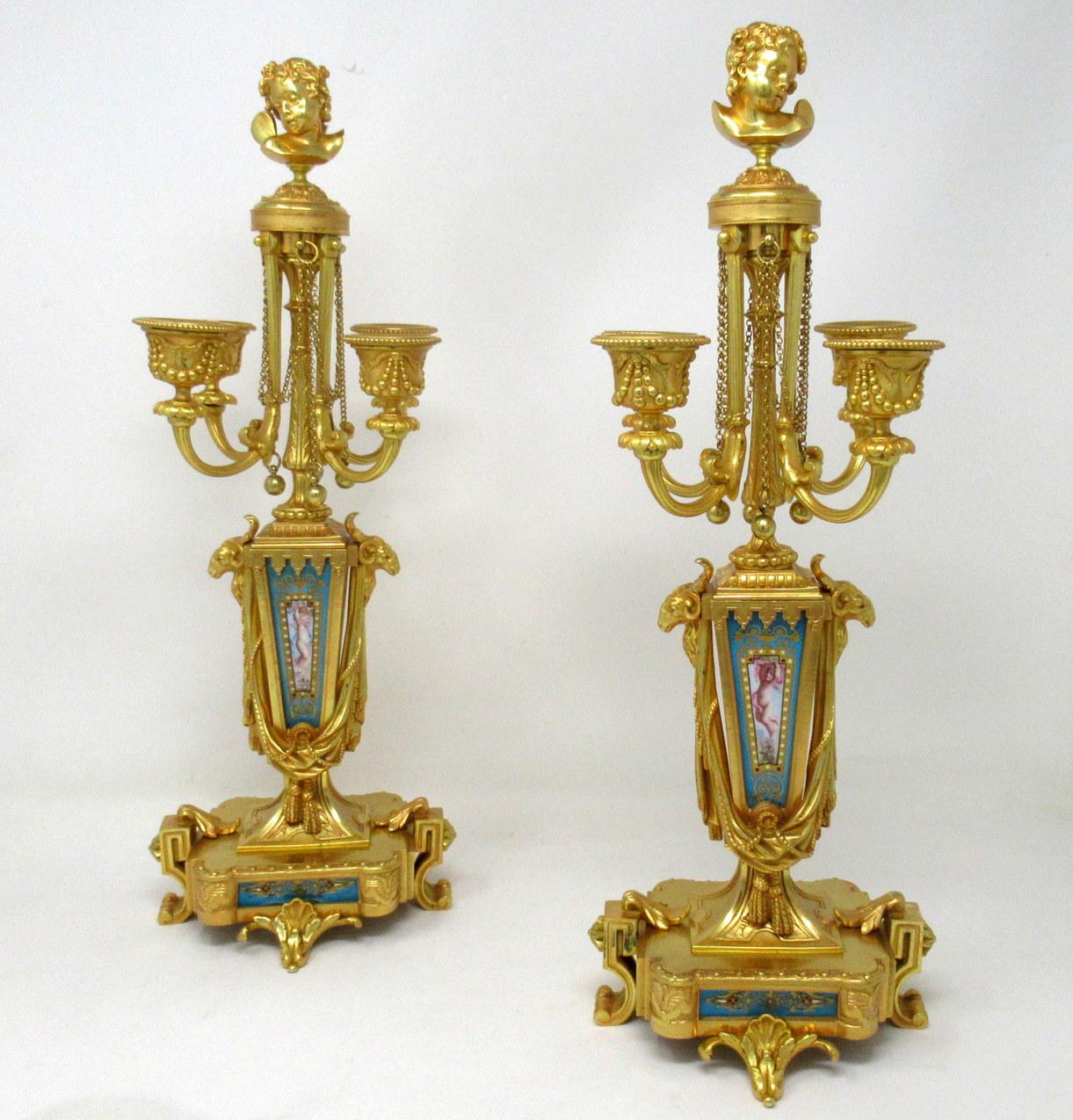 A fine pair of stylish and imposing French ormolu and hand decorated Sèvres panel four-arm table or mantel (fireplace) candelabras of exhibition quality, firmly attributed to Louis-Constant Sévin and cast by the Barbedienne Factory, mid to late 19th