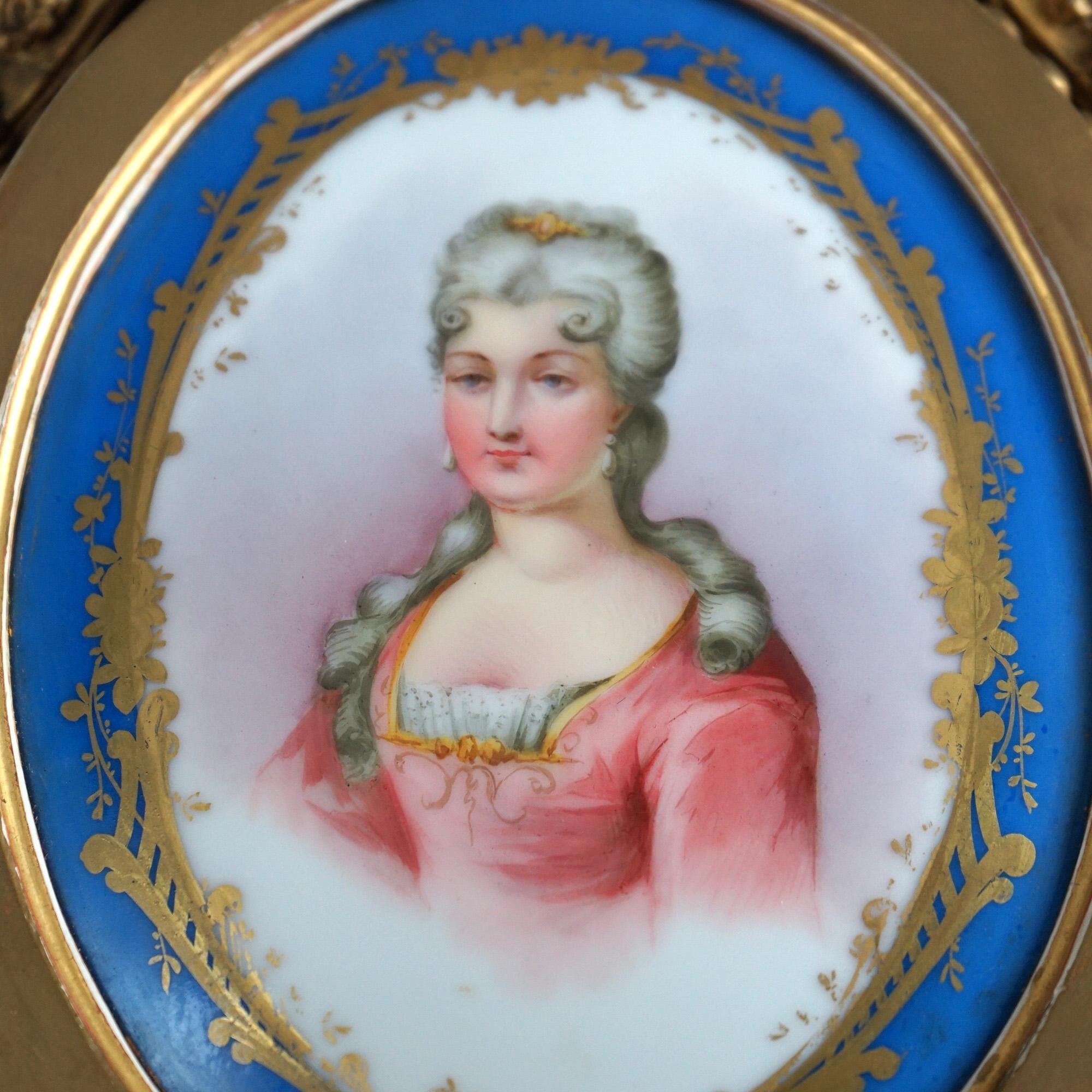 An antique pair of Sevres porcelain portrait plaques featuring Marie Antoinette seated in carved giltwood frames, 19thC

Measures- 17.5''H x 7.5''W x 1''D