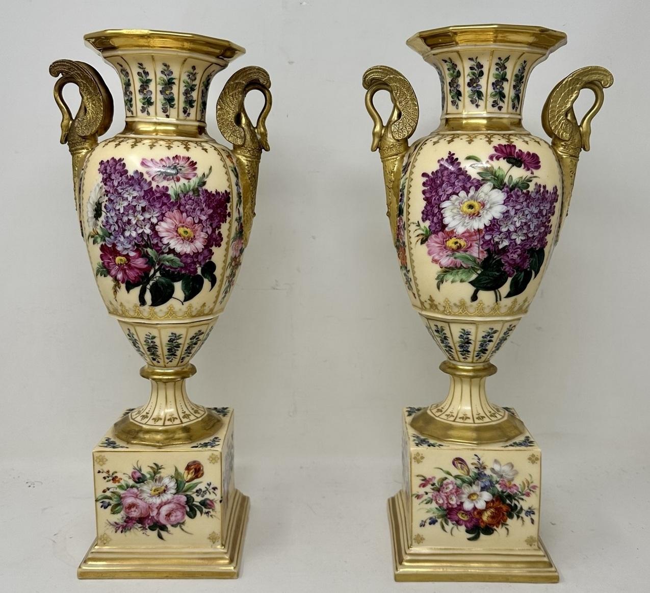 An Imposing and Stunning Pair French Sevres style Soft Paste Hand Decorated pale yellow ground Porcelain and gilt mounted twin swan neck scroll handle Table or Mantle Urns of traditional form, of outstanding quality and quite generous proportions,