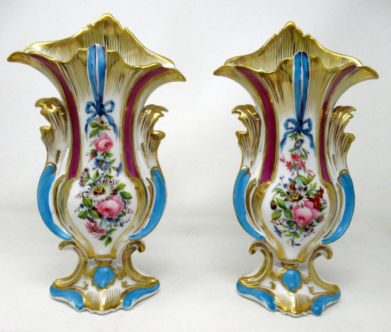 A very elegant pair of hand decorated Vieux Paris porcelain vases of generous proportions, outstanding quality and good untouched condition, last half of the 19th century.

Of ovoid form with Rococo elements and shaped and pointed upper rims, the