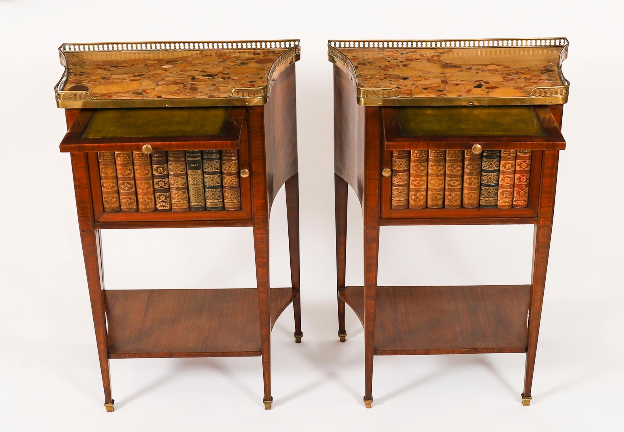 A thoroughly delightful pair of antique French walnut and tulipwood marble topped bedside cabinets, in the Louis XVI manner, Circa 1900 in date.

They feature shaped rectangular Italian Breccia marble tops fitted with three quarter brass galleries,