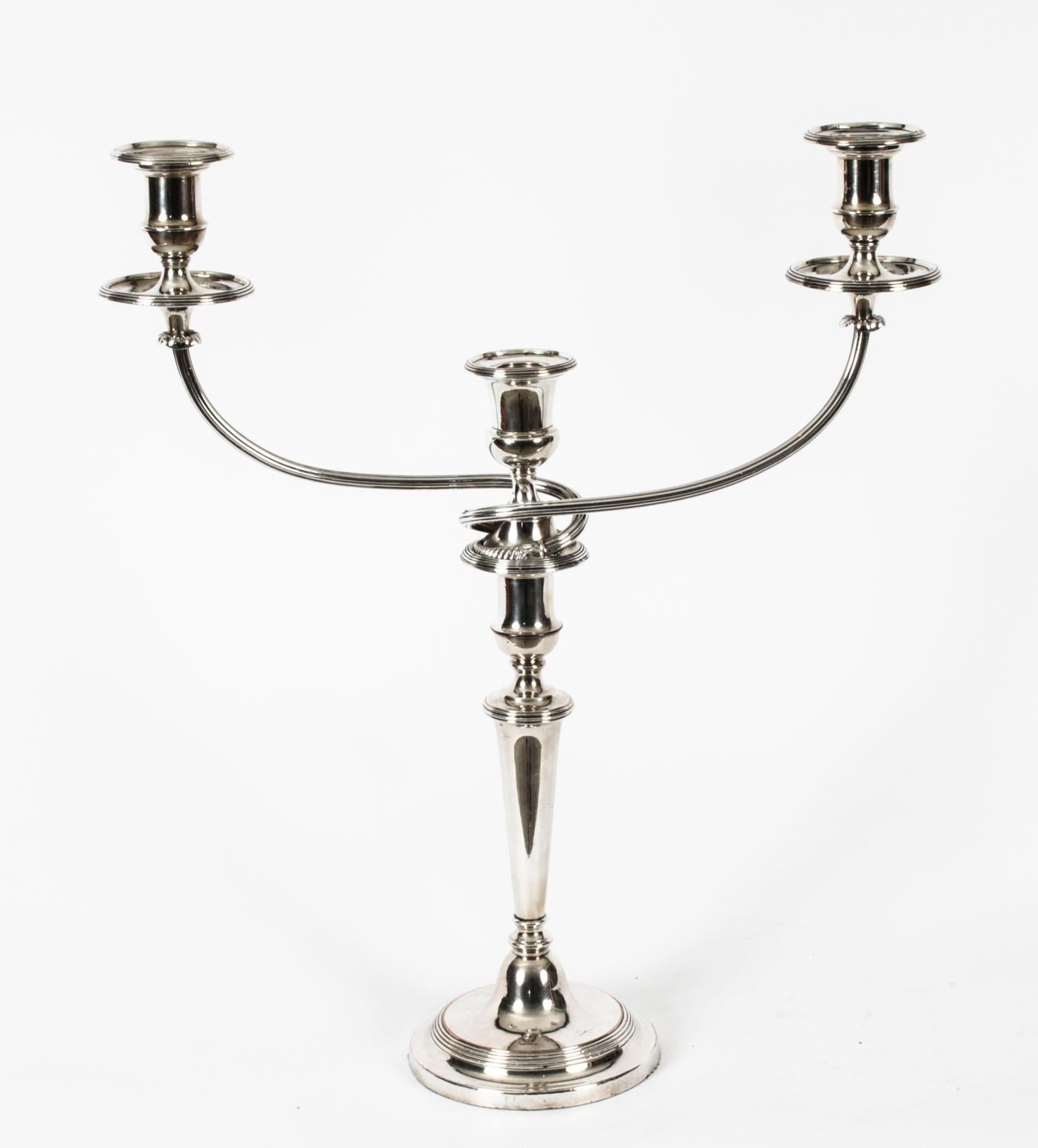 This is a stunning pair of antique English Old Sheffield silver on copper, three-light, two-branch table candelabras, circa 1780 in date, and bearing the makers mark of the renowned silversmith Matthew Boulton.
 
The candelabras feature detachable