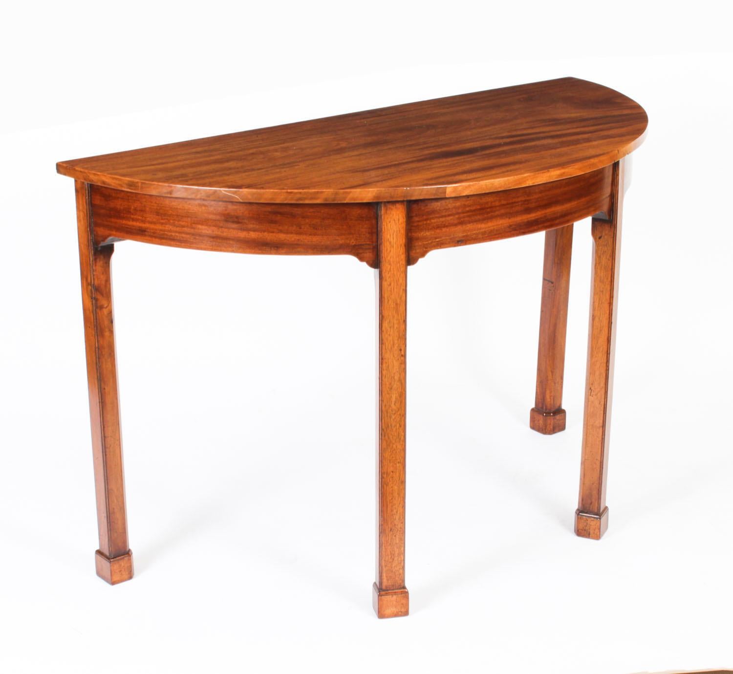 This is a superb pair of antique George III solid fruitwood demi-lune console tables, possibly Anglo Chinese, circa 1780 in date.

Each console has a beautiful half moon shaped top and they are each raised on elegant square tapering legs that