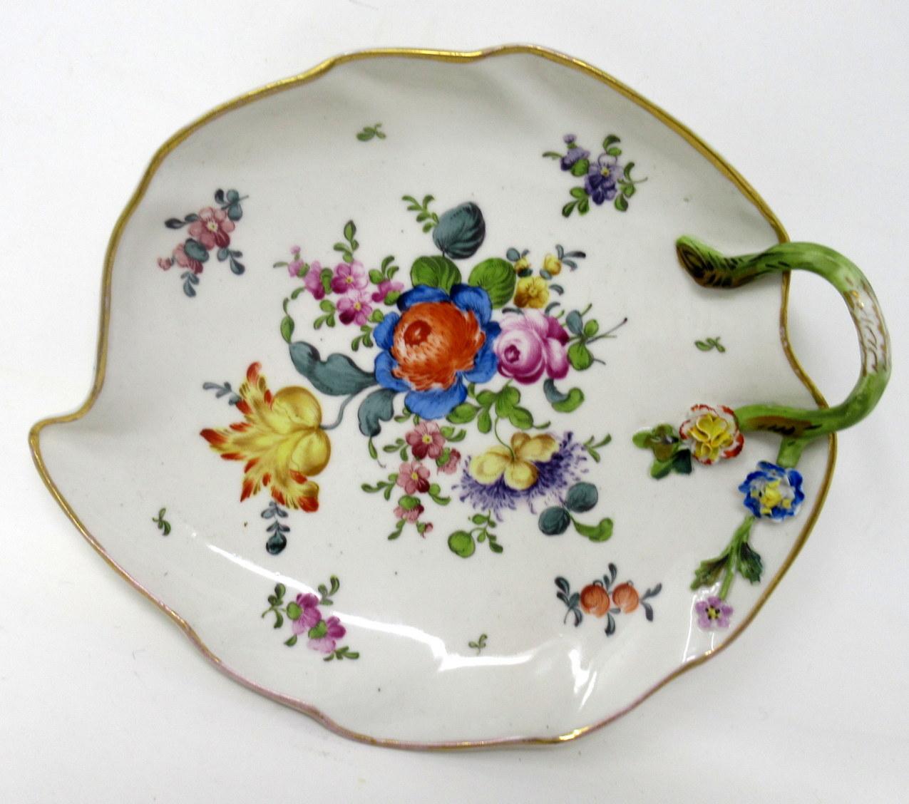 An exceptionally rare set of two German Meissen Floral Themed Porcelain cabinet plates of leaf form outline, mid nineteenth century. 

Each central reserve exquisitely hand painted with scattered views of decorative still life of Summer flowers
