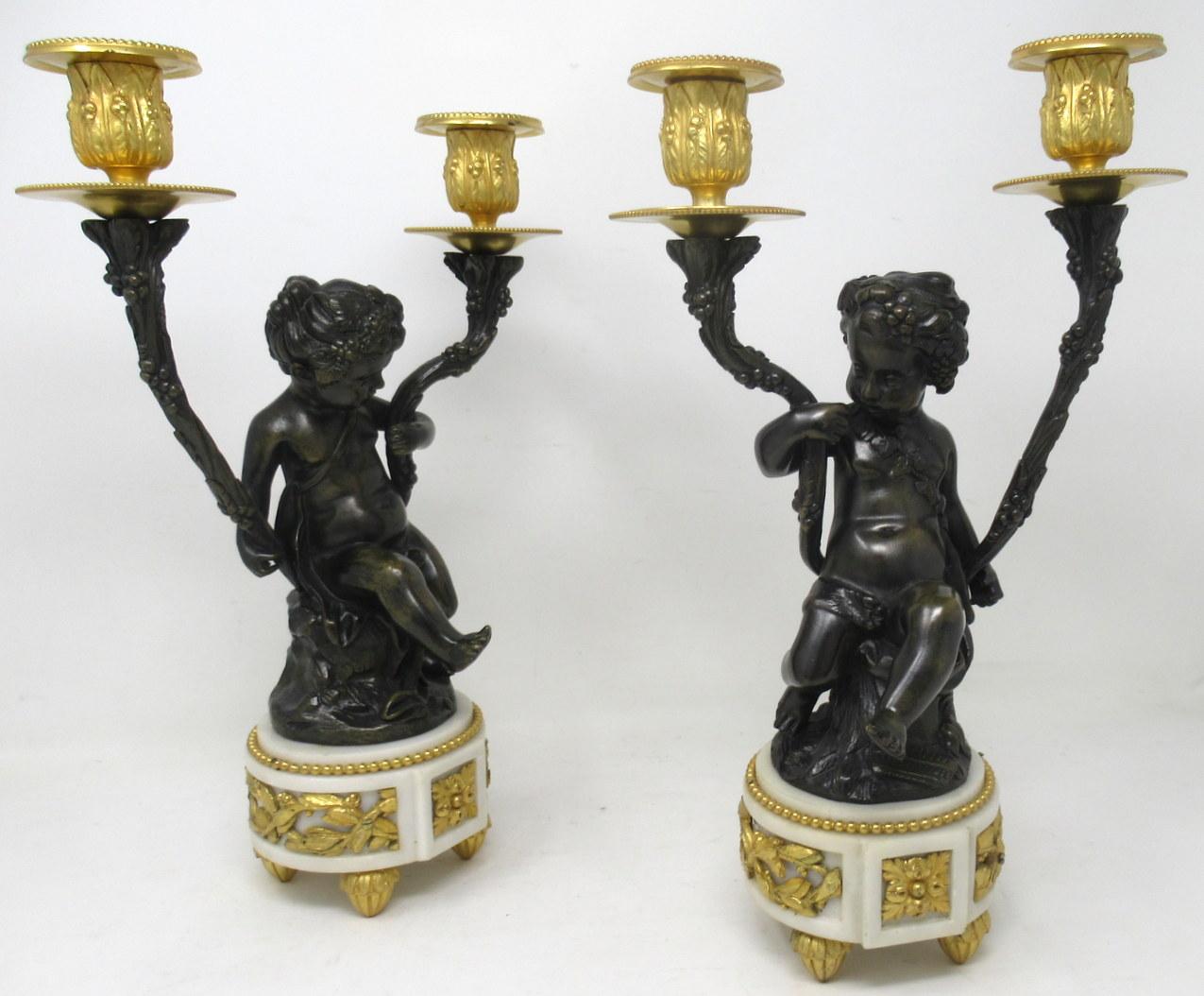 A very fine quality pair of French Louis XV inspired patinated and gilt bronze figural twin branch candelabra depicting Bacchanal Figures of seated Winged Cherubs or Putto. Both with finely sculped features and mounted atop naturalistically modelled